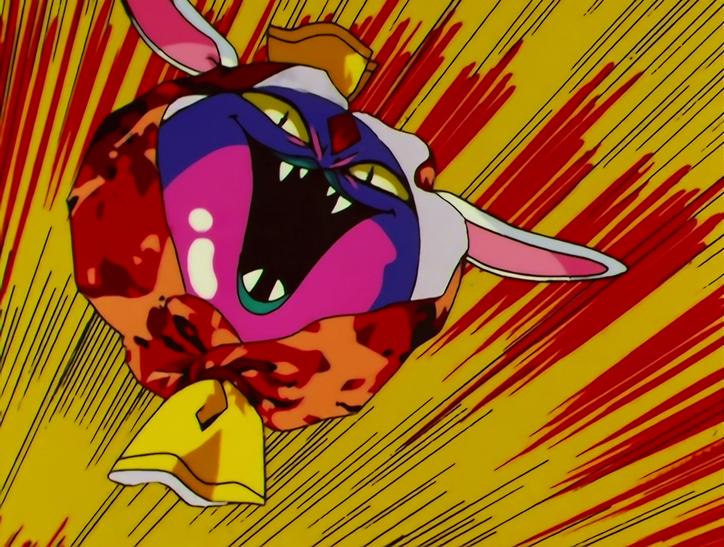 PeroPero is the same shape as before, but now her face is purple and pink, and she has a demonic expression with yellow eyes and sharp teeth.